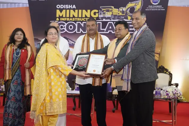 Felicitated at the Odisha Mining & Infrastructure Conclave: memento by Abriella Paintings for PHD Chamber of Commerce and Industry